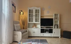 Bild 9: Wohnzimmer mit Terrasse und Aussenrollo