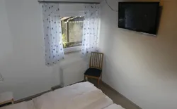 Bild 9: Schlafzimmer mit 40" TV